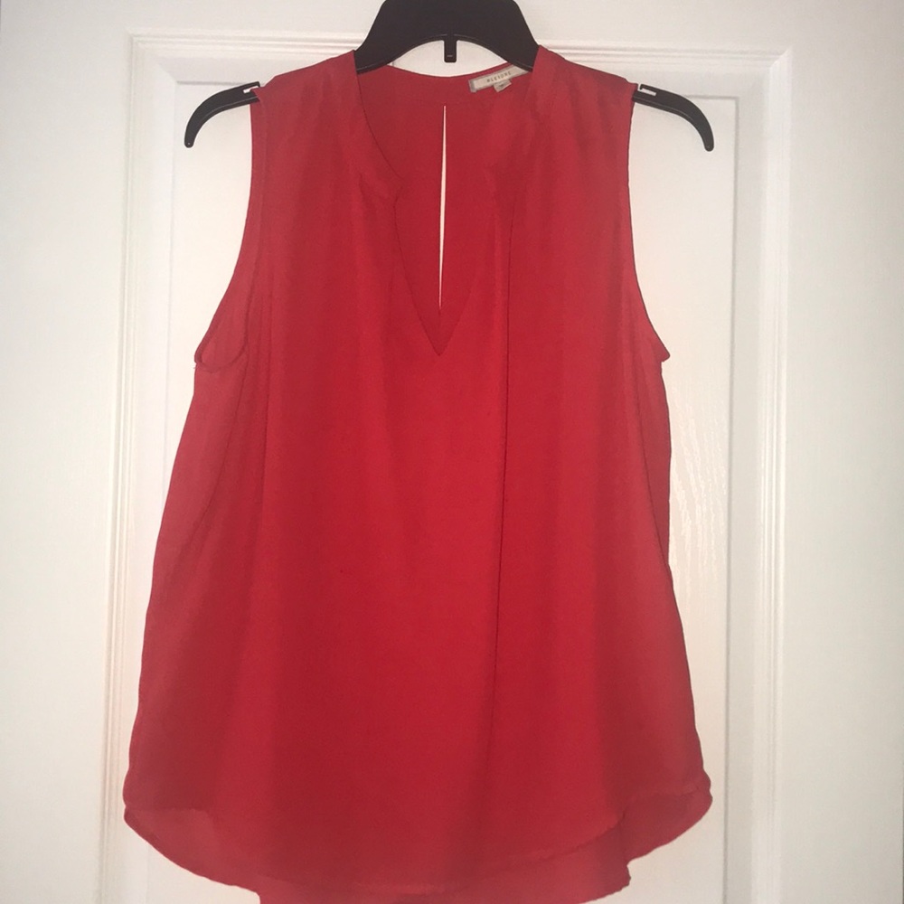 Sleeveless red blouse